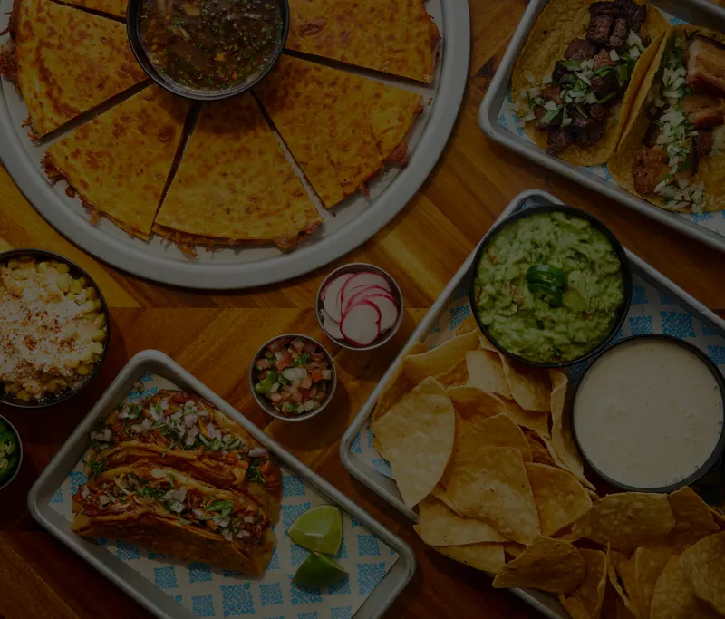 Rreal Tacos dishes — quesadilla, guacamole, chips and sides